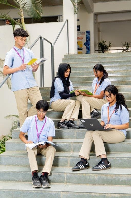 Students collaborating on the campus steps