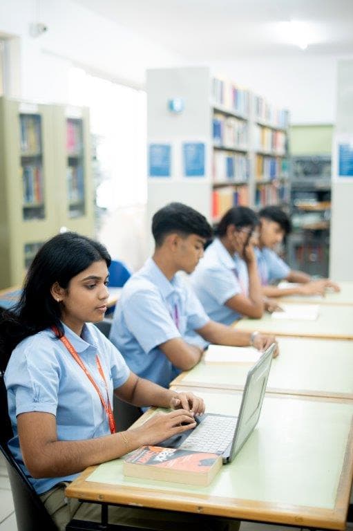 Students learning with laptops in the digital library